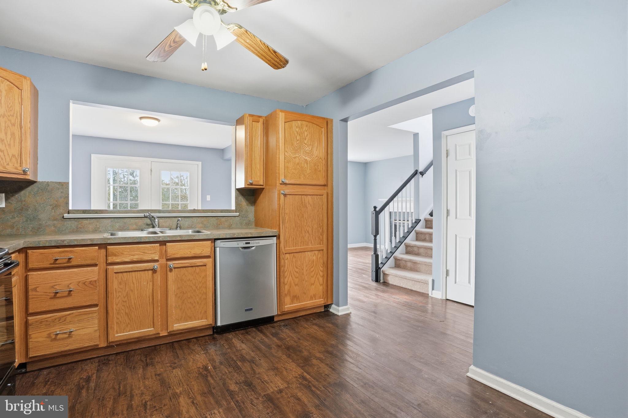 737 Seminary Street Pennsburg, PA 18073 - Photo 5 of 30 a view of a kitchen with a sink cabinet wooden floor and a window