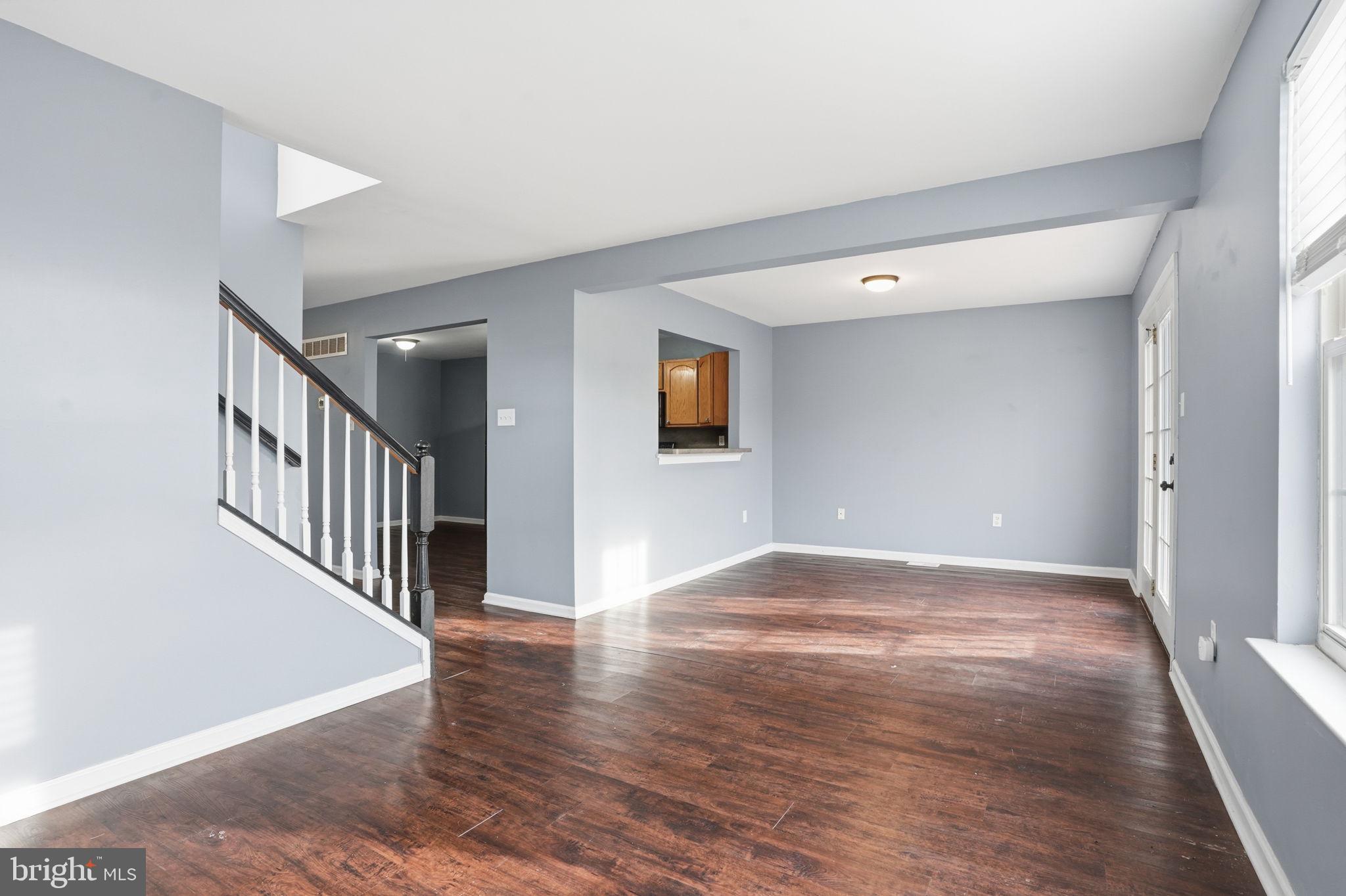 737 Seminary Street Pennsburg, PA 18073 - Photo 9 of 30 a view of an empty room with wooden floor and a window