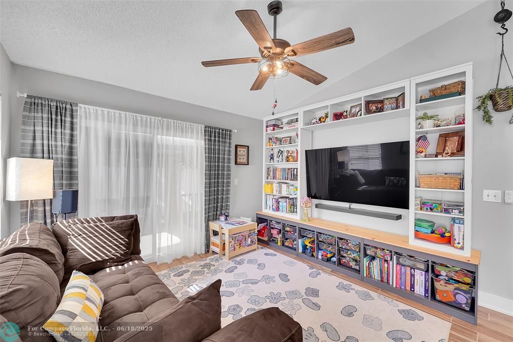 7542 Northwest 3rd Street Plantation, FL 33317 - Photo 13 of 31 a living room with furniture and a flat screen tv
