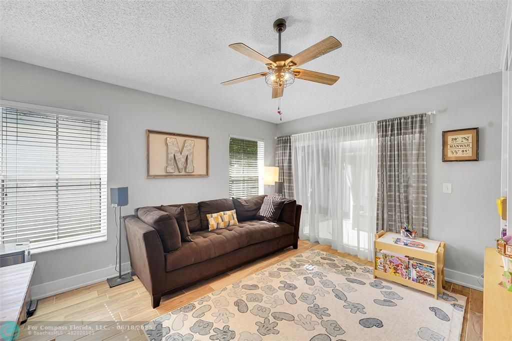 7542 Northwest 3rd Street Plantation, FL 33317 - Photo 14 of 31 a living room with furniture and two window