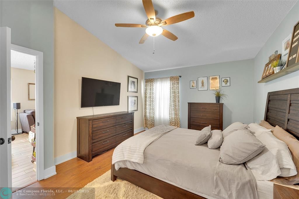 7542 Northwest 3rd Street Plantation, FL 33317 - Photo 15 of 31 a bedroom with a bed and a flat screen tv