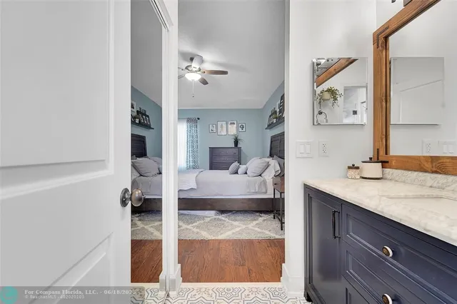 a en suite bathroom with a tub and mirror
