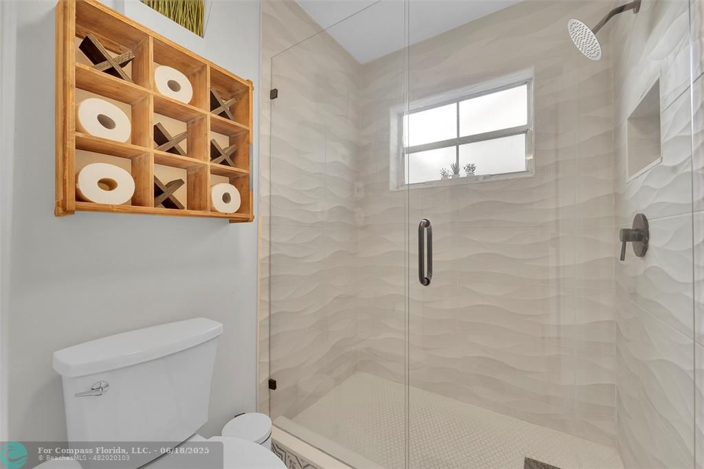 7542 Northwest 3rd Street Plantation, FL 33317 - Photo 21 of 31 a bathroom with a toilet and a shower