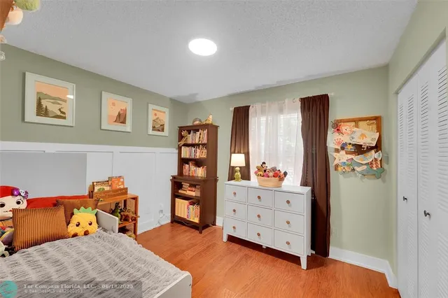 a bedroom with furniture and closet