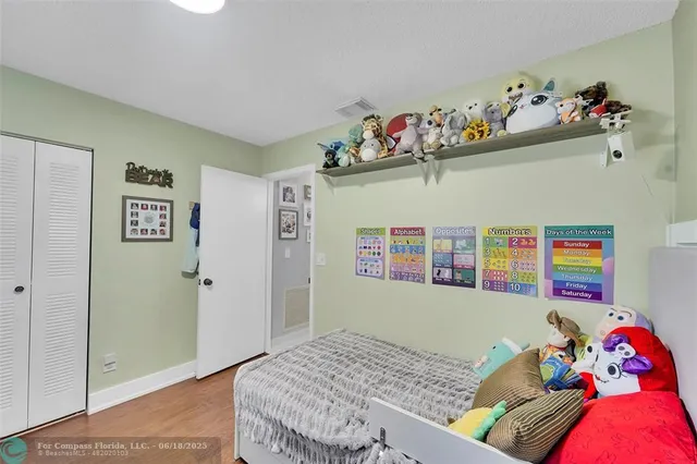 a bedroom with a bed and dresser