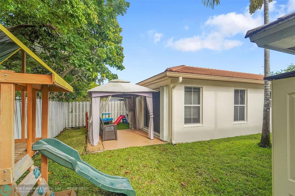 7542 Northwest 3rd Street Plantation, FL 33317 - Photo 29 of 31 a view of a house with a backyard