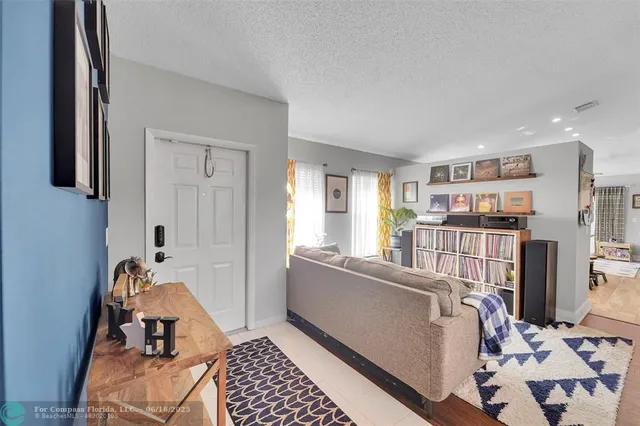 a bedroom with furniture and a book shelf
