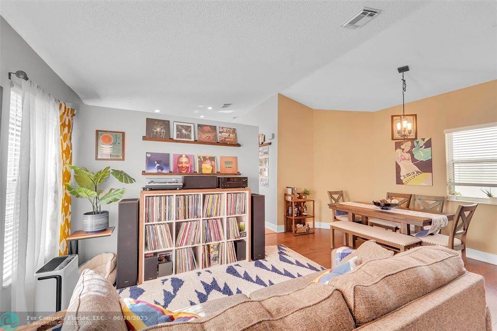 7542 Northwest 3rd Street Plantation, FL 33317 - Photo 7 of 31 a bedroom with furniture and a book shelf