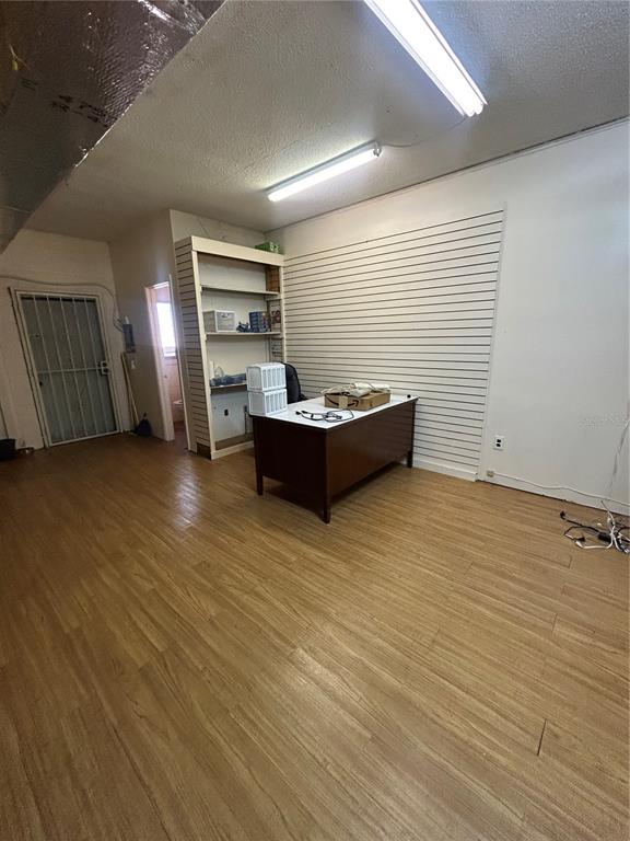 1864 Drew Street Clearwater, FL 33765 - Photo 4 of 6 an empty room with furniture and windows