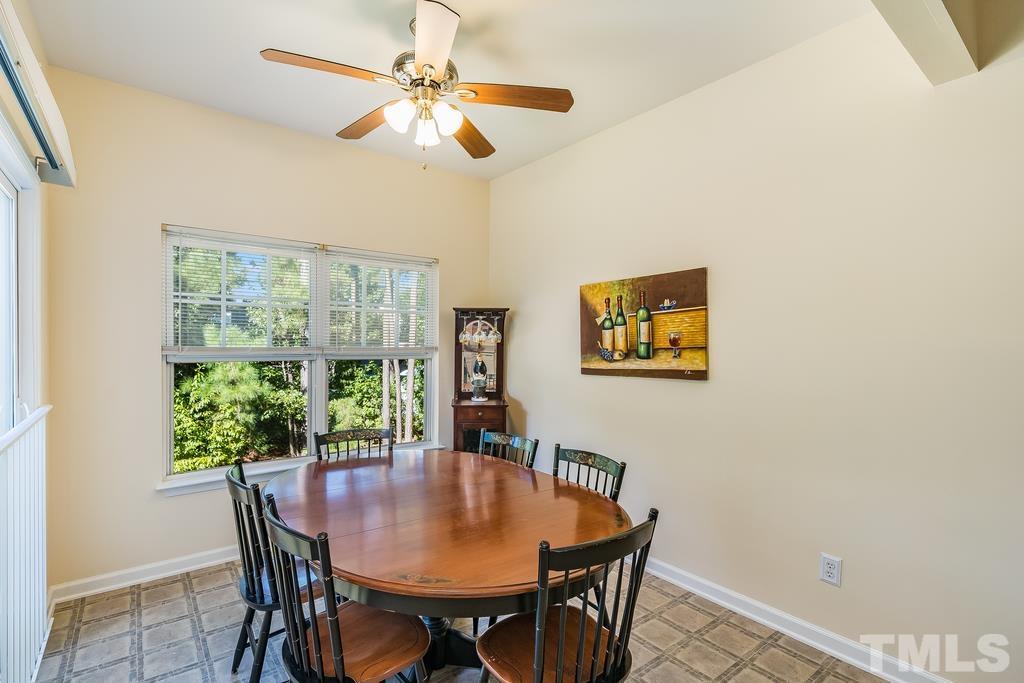 5145 Sandy Banks Road Raleigh, NC 27616 - Photo 11 of 30 a view of a dining room with furniture window and outside view