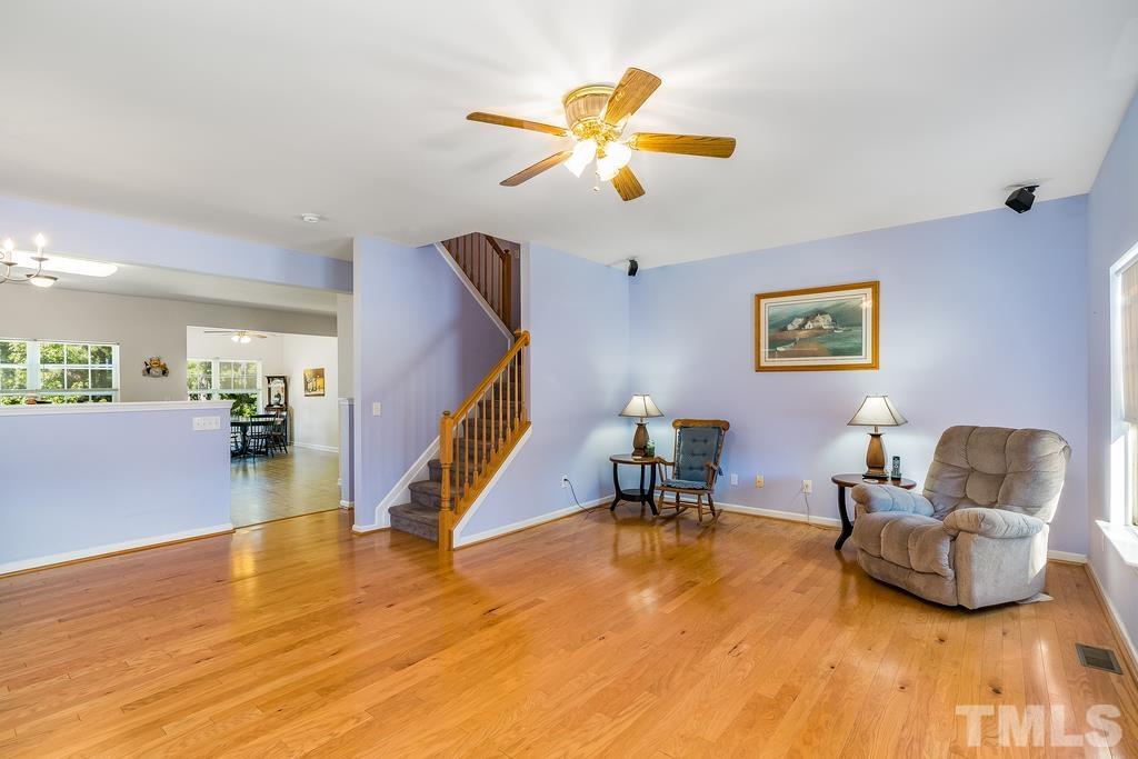 5145 Sandy Banks Road Raleigh, NC 27616 - Photo 16 of 30 a living room with furniture and a wooden floor