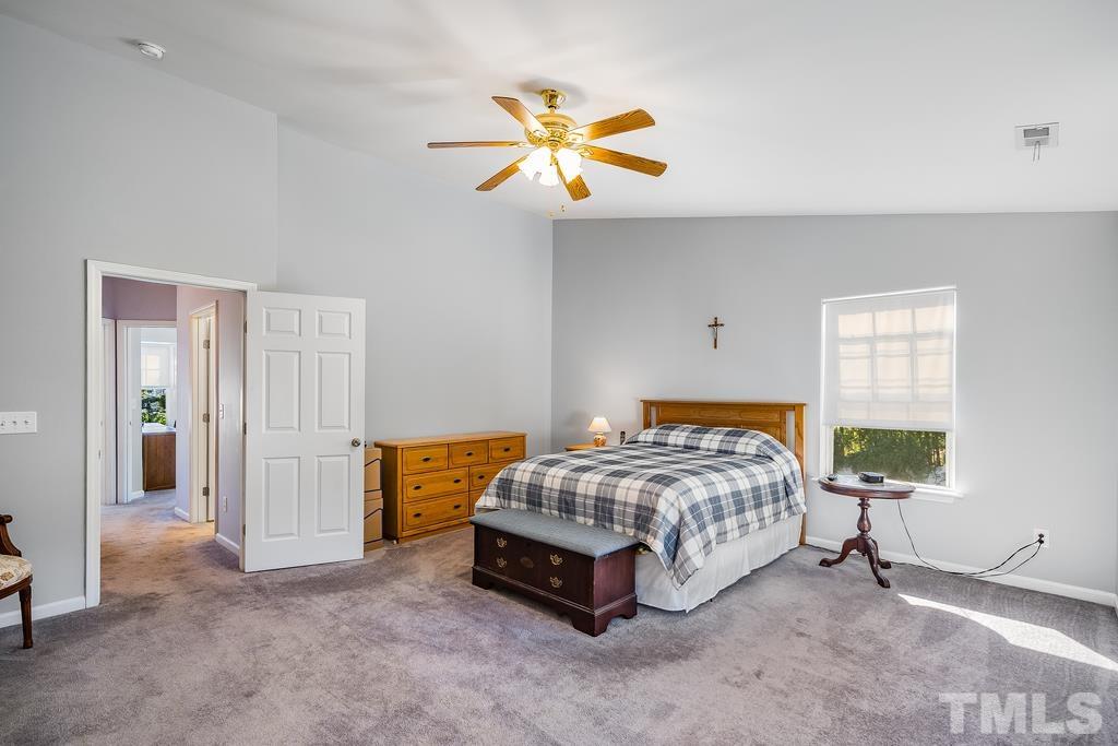 5145 Sandy Banks Road Raleigh, NC 27616 - Photo 25 of 30 a bedroom with a bed and a window
