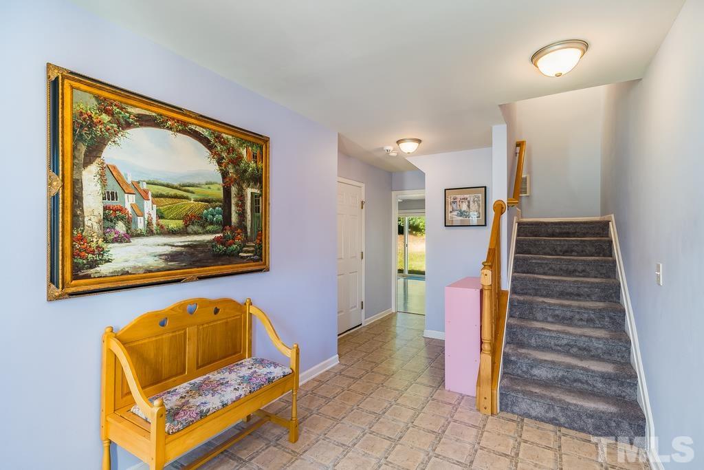 5145 Sandy Banks Road Raleigh, NC 27616 - Photo 5 of 30 a living room with furniture and a painting