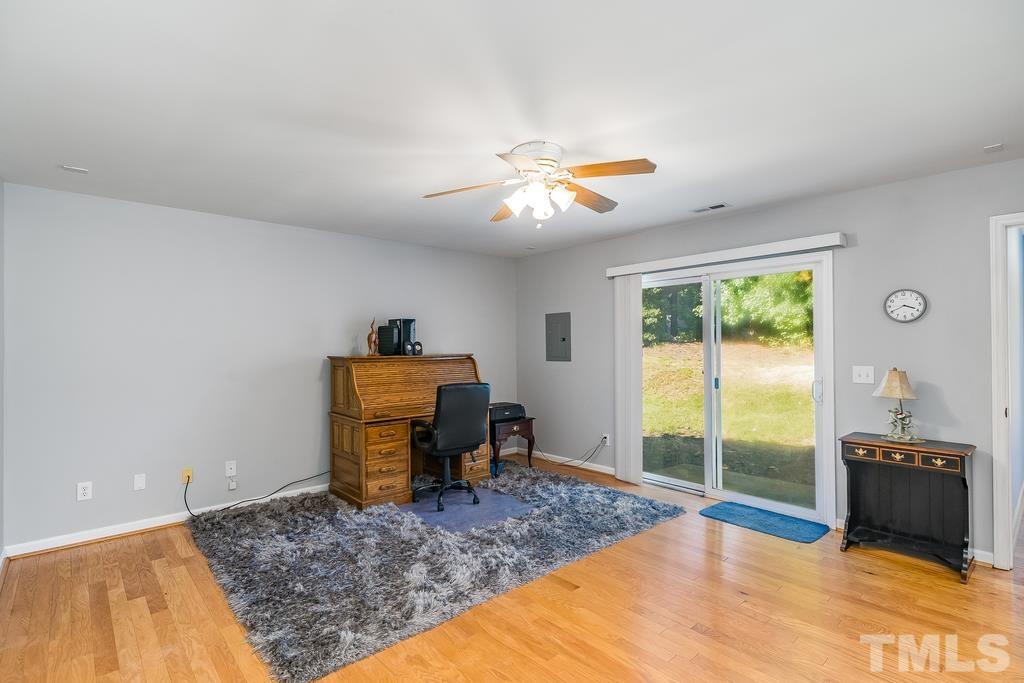 5145 Sandy Banks Road Raleigh, NC 27616 - Photo 6 of 30 a bedroom with a bed and ceiling fan
