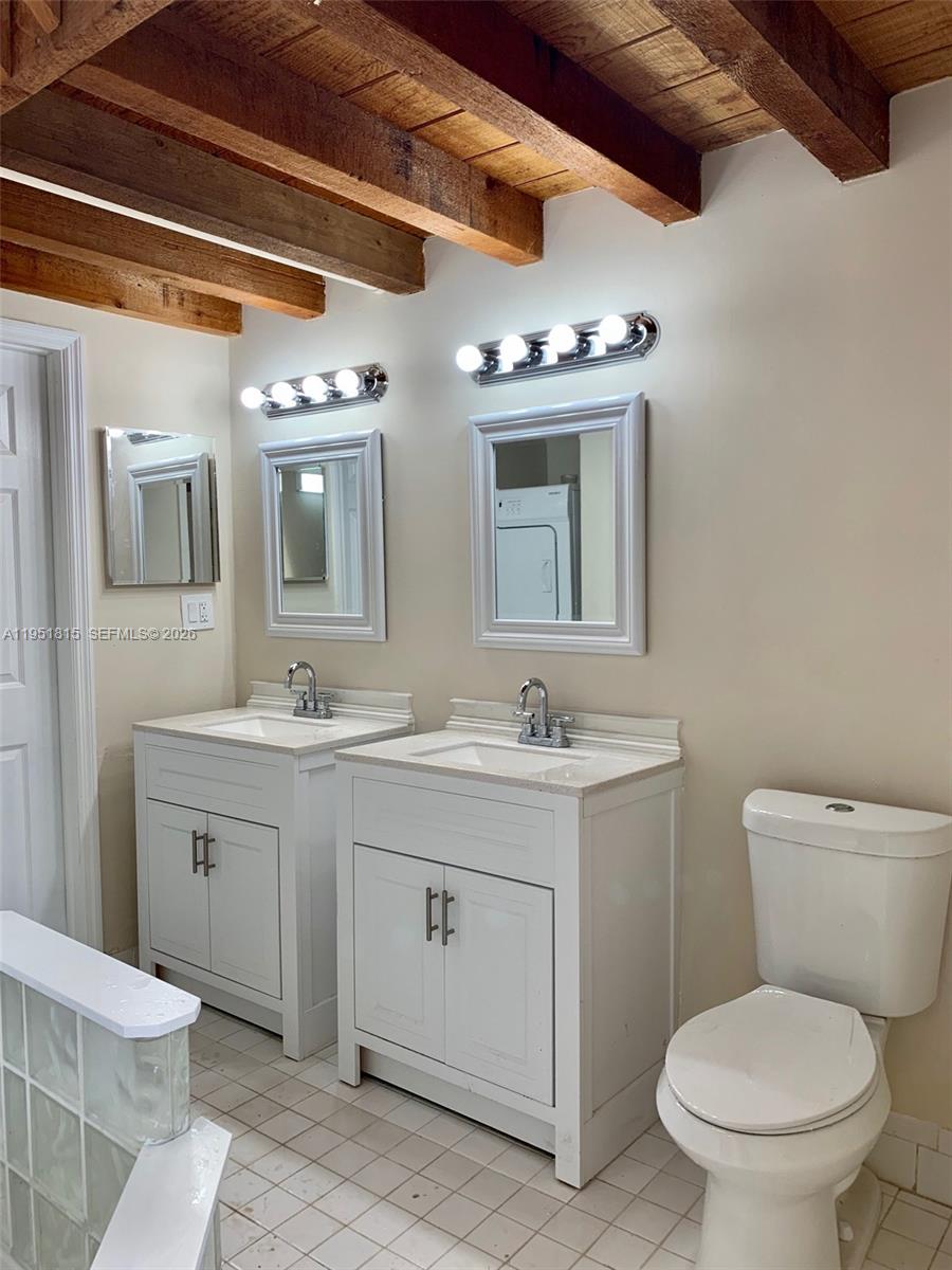 11318 Southwest 114th Cir Terrace Miami, FL 33176 - Photo 16 of 30 a bathroom with a toilet sink and mirror