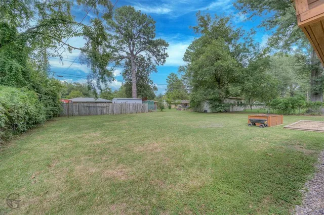 a backyard of a house with lots of green space