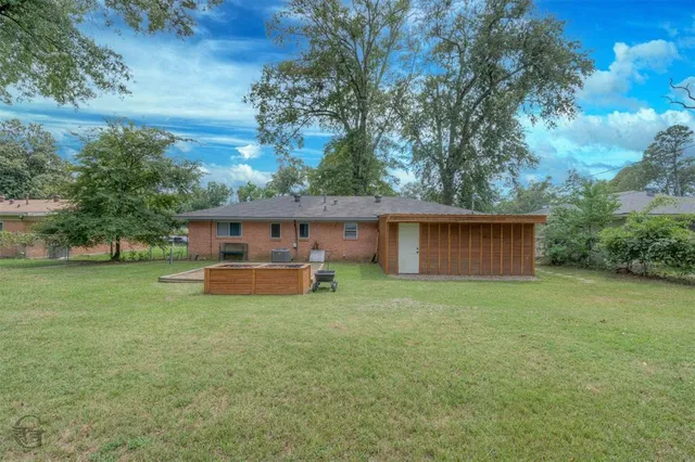 a house view with a garden space
