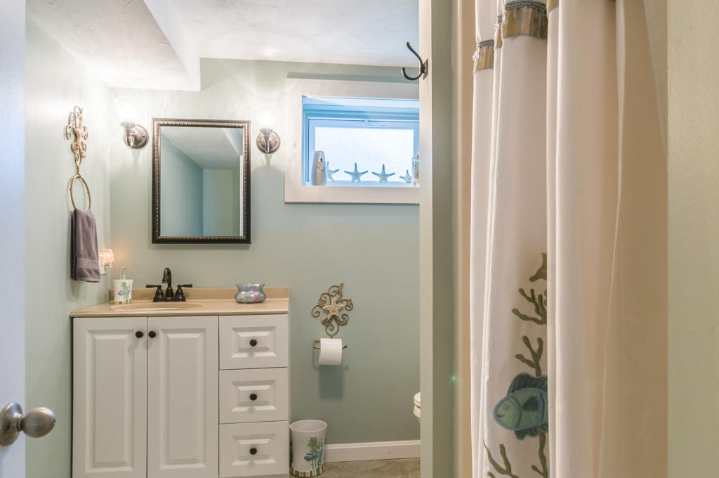 277 Phillips Road Sandwich, MA 02563 - Photo 36 of 47 a bathroom with a double vanity sink and a mirror