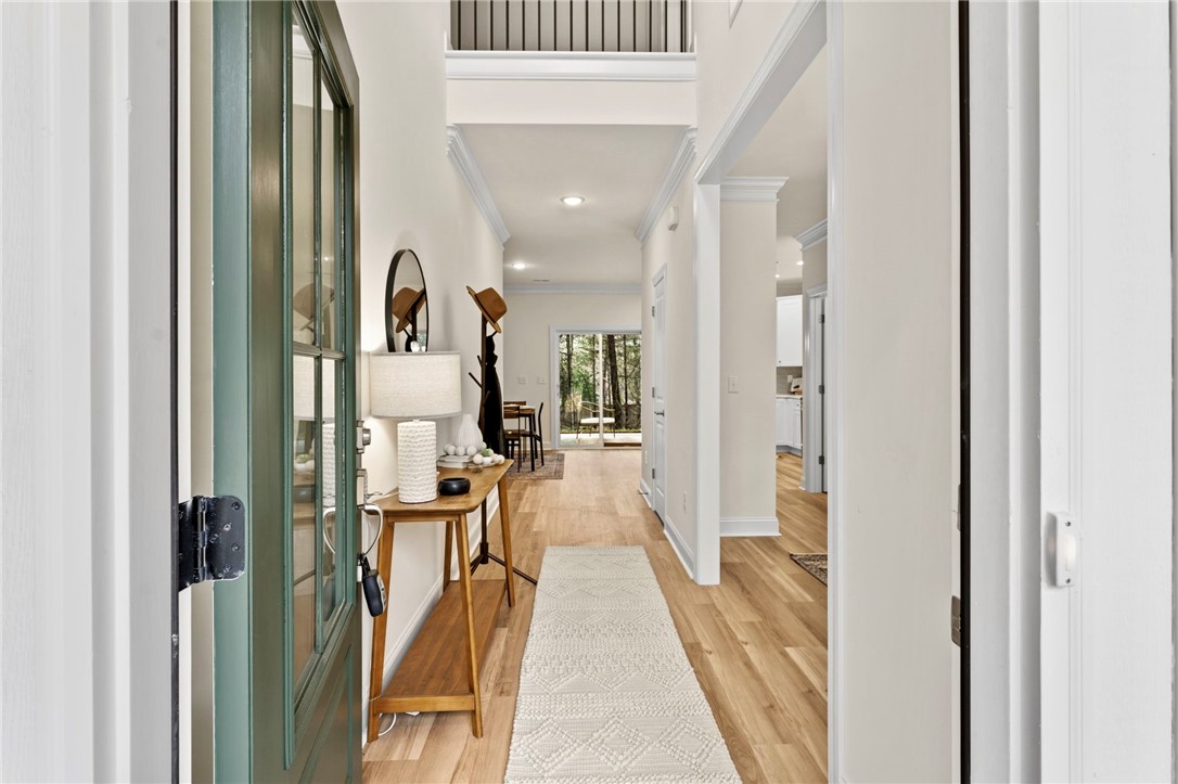 505 Fire Tower Road Williamston, SC 29697 - Photo 3 of 37 This bright entry hall features hardwood flooring and an open view to the dining area.