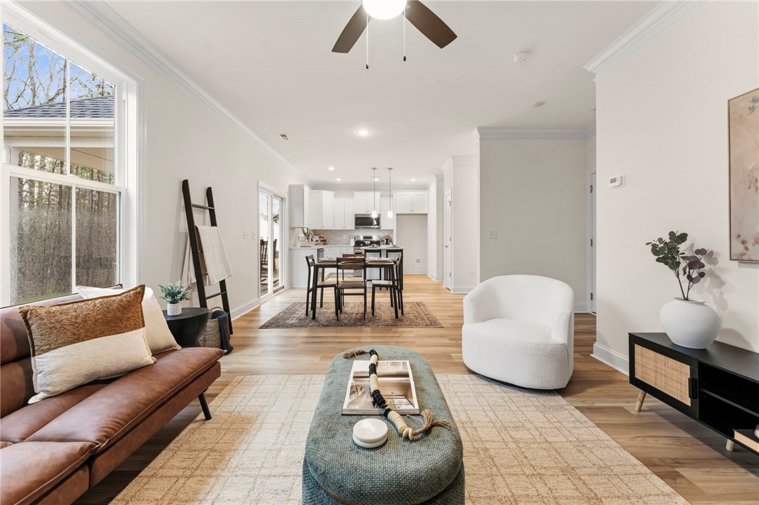 505 Fire Tower Road Williamston, SC 29697 - Photo 7 of 37 This bright, open-concept living space offers seamless transitions between rooms.