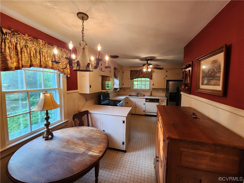 185 Washington Street Boydton, VA 23917 - Photo 18 of 45 a living room with furniture and a chandelier