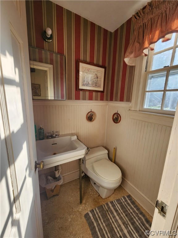 185 Washington Street Boydton, VA 23917 - Photo 19 of 45 a bathroom with a toilet a sink and a mirror