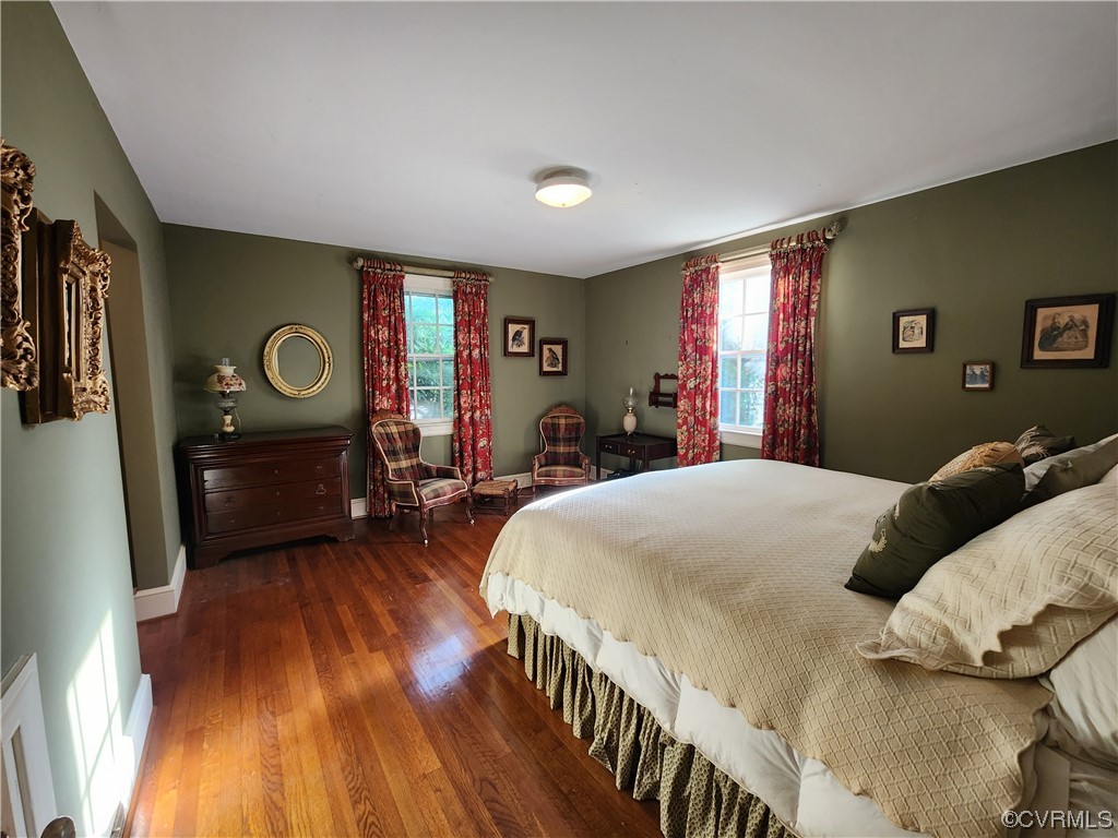 185 Washington Street Boydton, VA 23917 - Photo 23 of 45 a bedroom with a bed and wooden floor