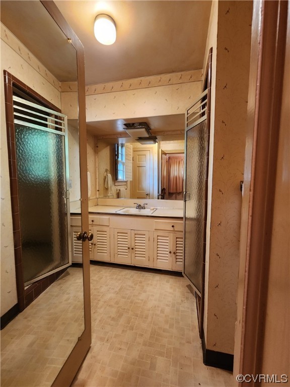 185 Washington Street Boydton, VA 23917 - Photo 25 of 45 a bathroom with a sink a mirror and a shower