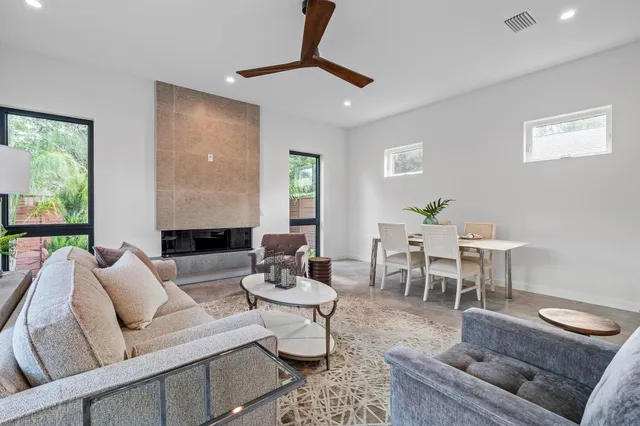 a bedroom with a bed a dresser and a window