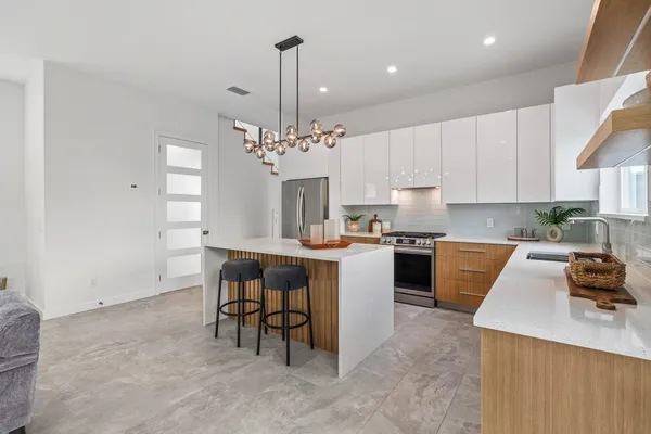 a bedroom with a bed and windows