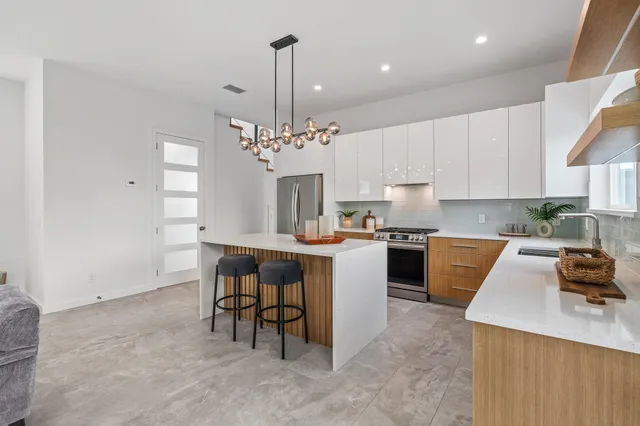 a bedroom with a bed and windows