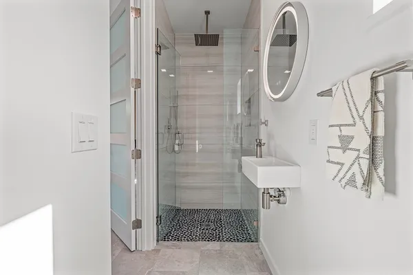 a bedroom with a bed and a walk in closet