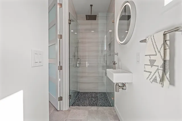 a bedroom with a bed and a walk in closet