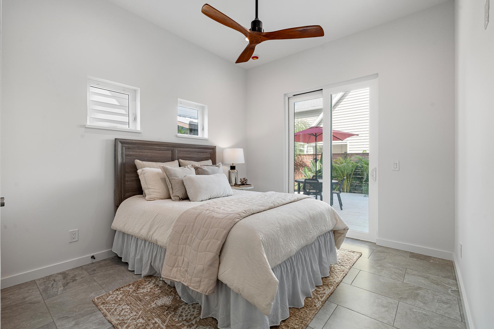 327 Minorca Avenue St. Augustine, FL 32080 - Photo 22 of 74 a bedroom with a bed a dresser and a window