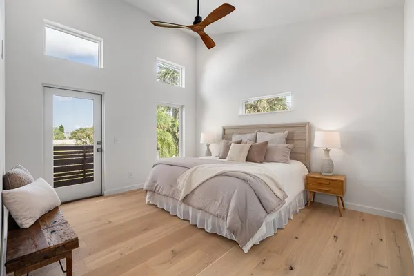 a bedroom with a bed and a table