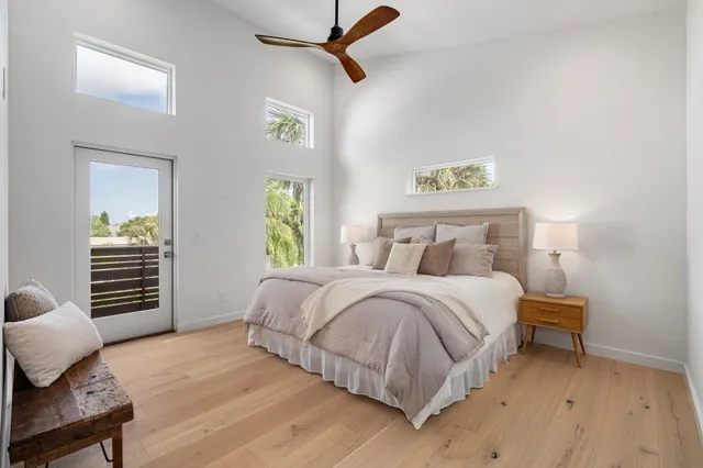 a bedroom with a bed and a table