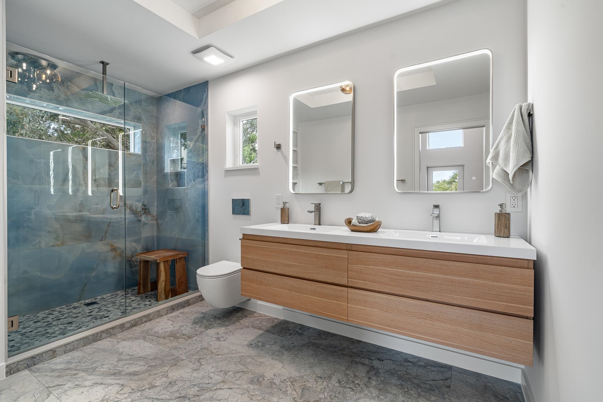 327 Minorca Avenue St. Augustine, FL 32080 - Photo 28 of 74 a bathroom with a double vanity sink toilet and shower