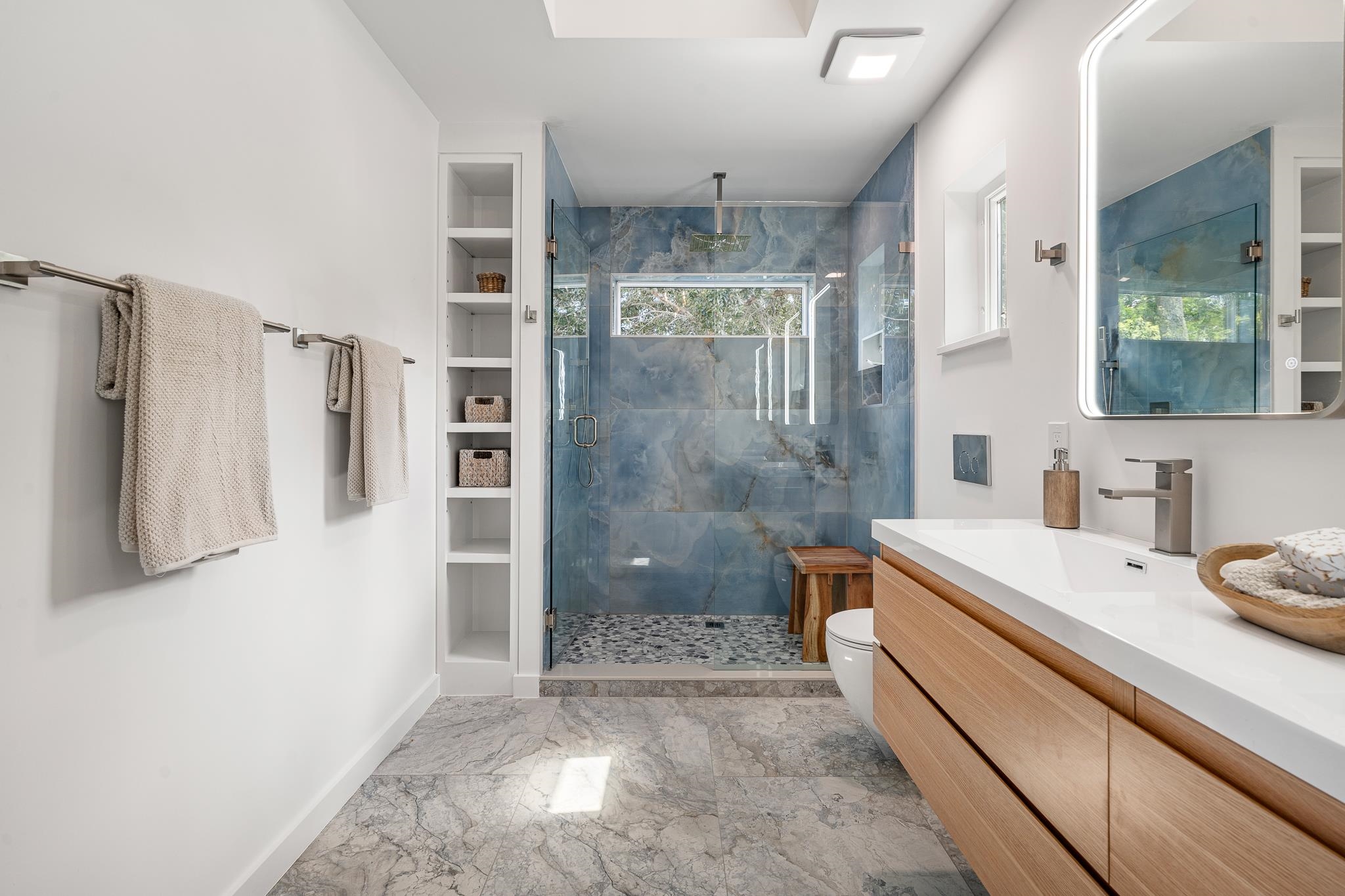 327 Minorca Avenue St. Augustine, FL 32080 - Photo 29 of 74 a bathroom with a granite countertop sink a toilet a shower and a mirror