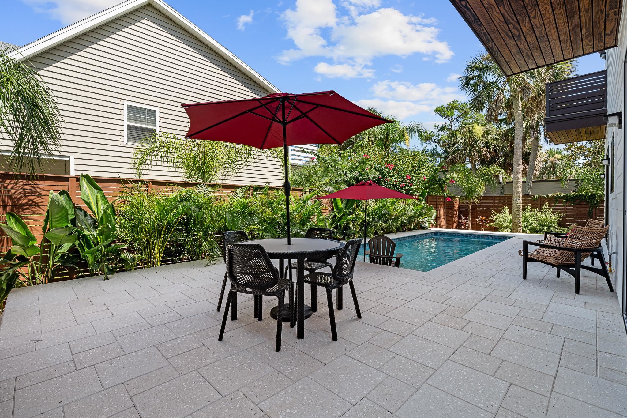 327 Minorca Avenue St. Augustine, FL 32080 - Photo 45 of 74 a view of a house with backyard sitting area and garden