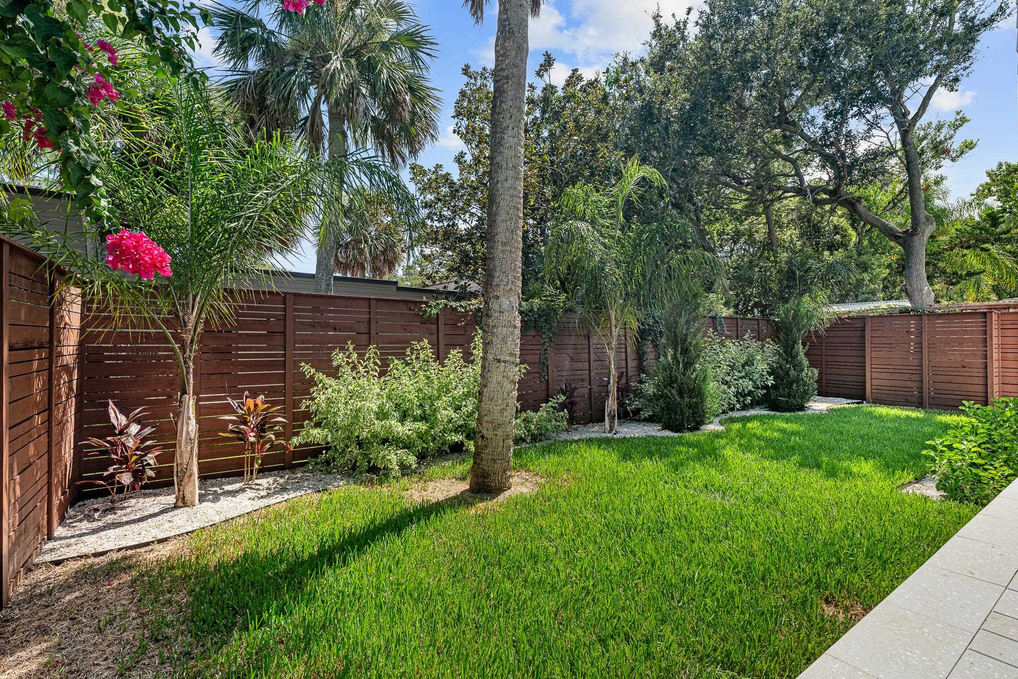 327 Minorca Avenue St. Augustine, FL 32080 - Photo 46 of 74 a backyard of a house with lots of green space