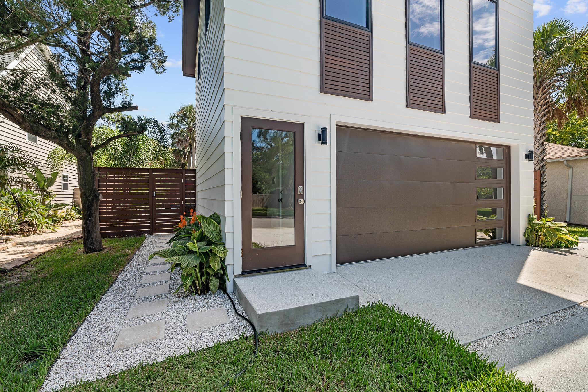 327 Minorca Avenue St. Augustine, FL 32080 - Photo 50 of 74 a front view of a house with a garden