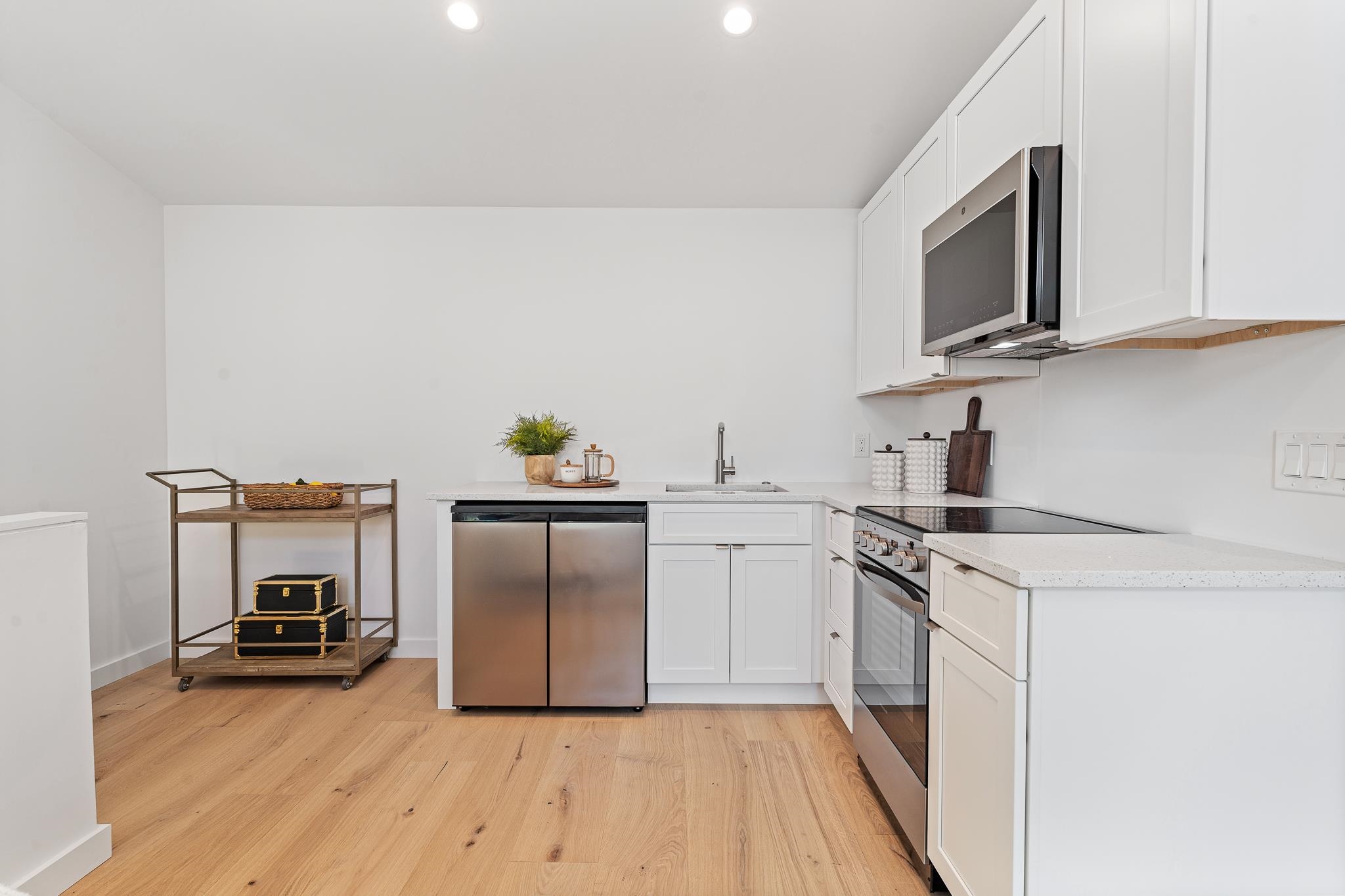 327 Minorca Avenue St. Augustine, FL 32080 - Photo 67 of 74 a kitchen with a refrigerator sink and microwave