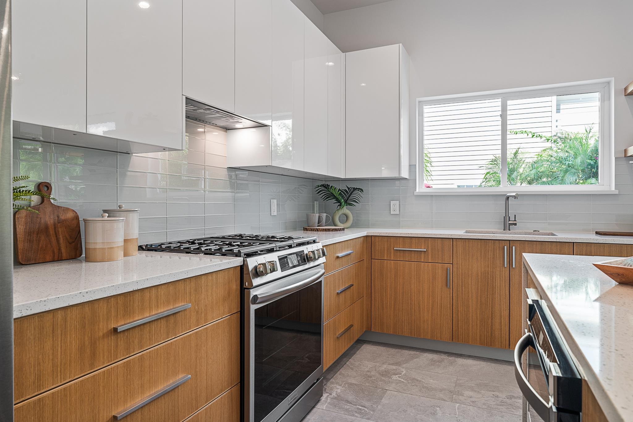 327 Minorca Avenue St. Augustine, FL 32080 - Photo 10 of 74 a kitchen with a stove a sink and a window