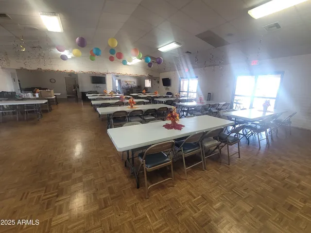 an aerial view of a house with a yard and lake view