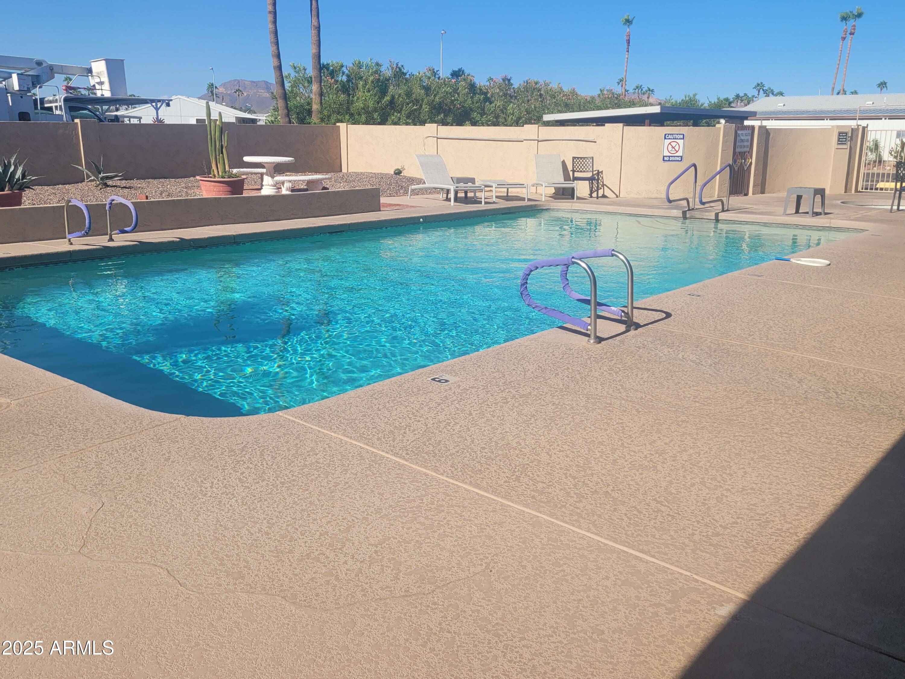 834 South Meridian Road, Unit 123 Apache Junction, AZ 85120 - Photo 24 of 26 an aerial view of a house with a yard and lake view
