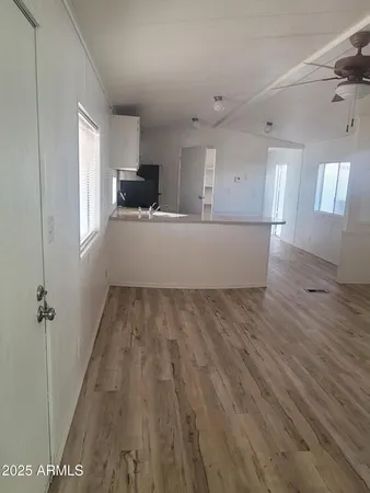 a view of an empty room with a window