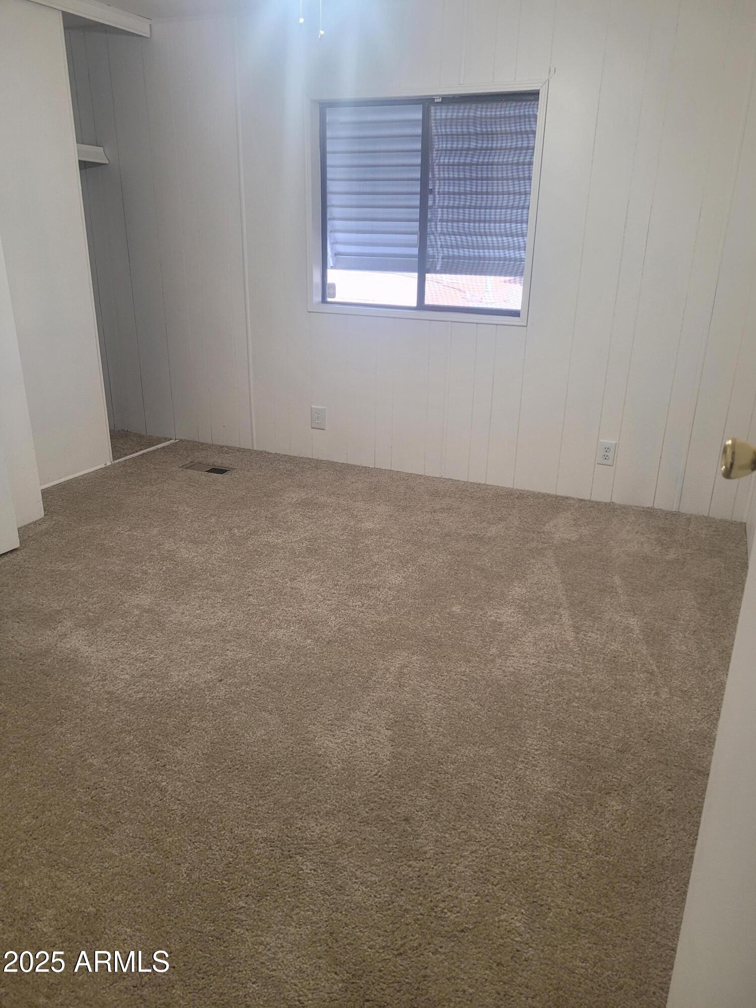 834 South Meridian Road, Unit 123 Apache Junction, AZ 85120 - Photo 5 of 26 a view of an empty room with a window