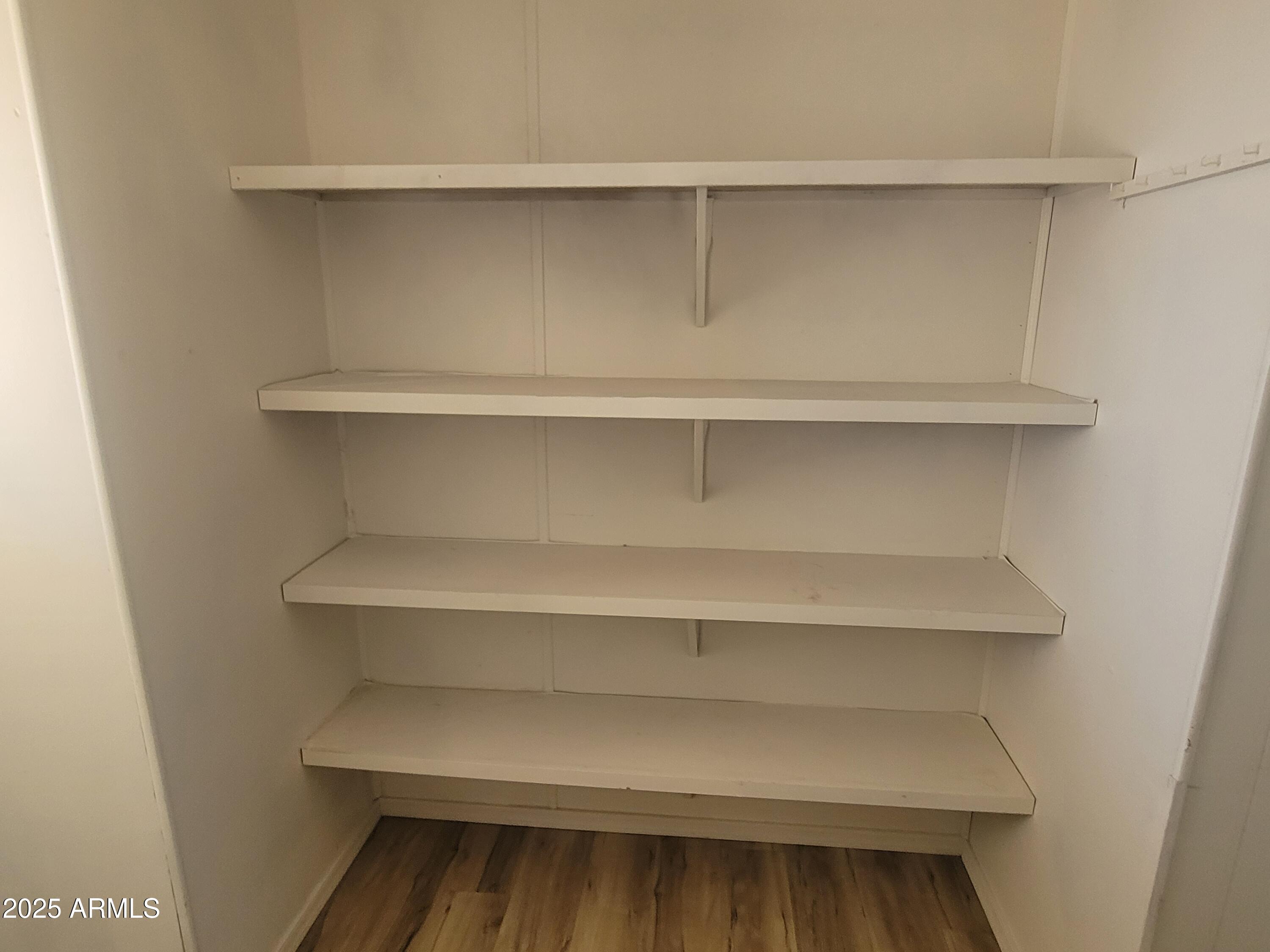 834 South Meridian Road, Unit 123 Apache Junction, AZ 85120 - Photo 8 of 26 a view of a closet with shelf