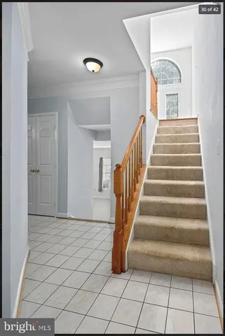 a view of entryway and hall with a window