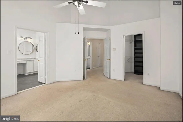 a view of empty room with closet and fan